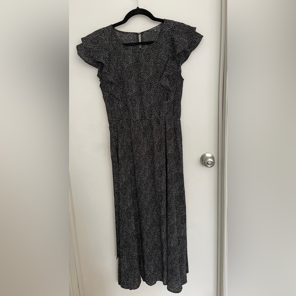 Black and white flowy midi dress with high neck.